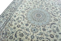 Backside of handmade New Nain rug showing knot structure and weave density