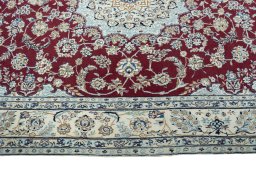 Corner detail of New Nain rug showing border pattern and Cork pile