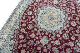 Backside of handmade New Nain rug showing knot structure and weave density