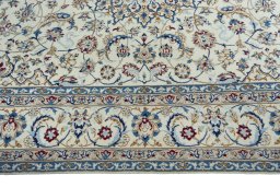Corner detail of 2000s Nain rug showing border pattern and Wool pile
