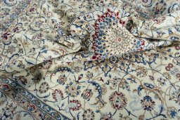 Surface texture of 2000s Nain rug with natural Wool and intricate pattern