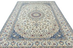Surface texture of 2000s Nain rug with natural Wool and intricate pattern