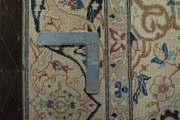 Backside of handmade 2000s Nain rug showing knot structure and weave density