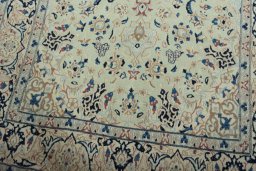 Close-up detail of 2000s Nain rug from Iran / Persia showing Wool weave