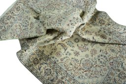 Surface texture of 2000s Nain rug with natural Wool and intricate pattern