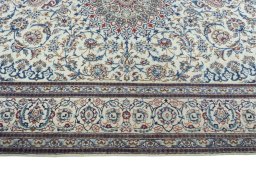Corner detail of New Nain rug showing border pattern and Wool pile