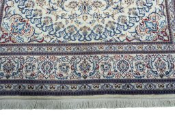 Full view of New Nain rug from Iran / Persia, 295 × 200 cm in Beige tones