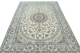 Surface texture of 2000s Nain rug with natural Wool and intricate pattern