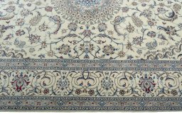 Corner detail of New Nain rug showing border pattern and Wool pile