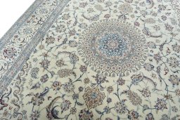 Backside of handmade New Nain rug showing knot structure and weave density