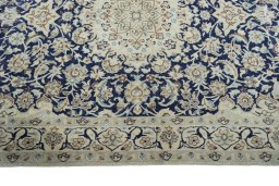Corner detail of 2000s Nain rug showing border pattern and Wool pile