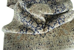 Surface texture of 2000s Nain rug with natural Wool and intricate pattern