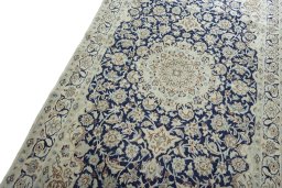 Backside of handmade 2000s Nain rug showing knot structure and weave density