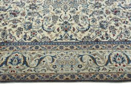 Corner detail of 2000s Nain rug showing border pattern and Wool pile