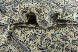 Surface texture of 2000s Nain rug with natural Wool and intricate pattern