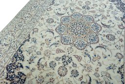 Backside of handmade New Nain rug showing knot structure and weave density