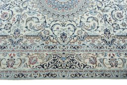 Corner detail of 2000s Nain rug showing border pattern and Wool pile
