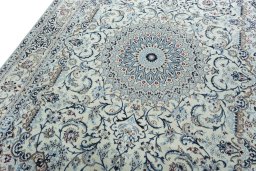 Backside of handmade 2000s Nain rug showing knot structure and weave density