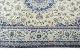 Corner detail of 2000s Nain rug showing border pattern and Cork pile