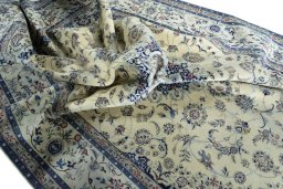 Surface texture of 2000s Nain rug with natural Cork and intricate pattern