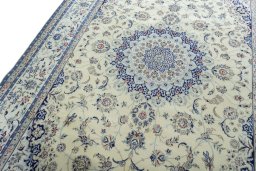 Backside of handmade 2000s Nain rug showing knot structure and weave density
