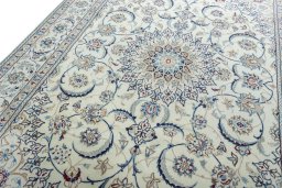 Backside of handmade New Nain rug showing knot structure and weave density