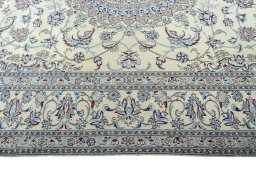 Corner detail of 2000s Nain rug showing border pattern and Wool pile
