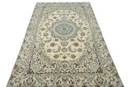 Surface texture of 2000s Nain rug with natural Wool and intricate pattern