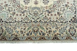 Full view of 2000s Nain rug from Iran / Persia, 257 × 152 cm in Beige tones