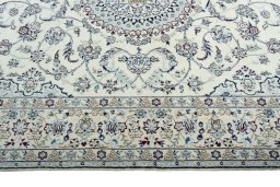 Corner detail of 2000s Nain rug showing border pattern and Wool pile