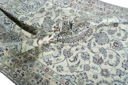 Surface texture of 2000s Nain rug with natural Wool and intricate pattern