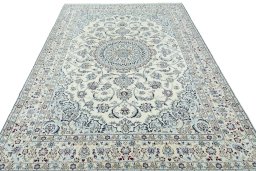 Surface texture of 2000s Nain rug with natural Wool and intricate pattern