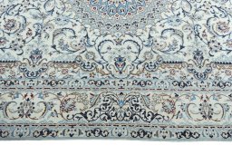 Corner detail of 2000s Nain rug showing border pattern and Wool pile