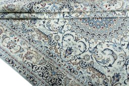 Close-up detail of 2000s Nain rug from Iran / Persia showing Wool weave
