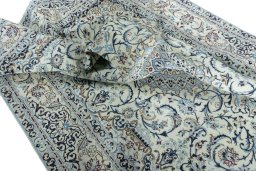 Surface texture of 2000s Nain rug with natural Wool and intricate pattern