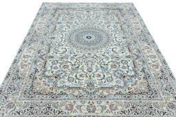 Surface texture of 2000s Nain rug with natural Wool and intricate pattern