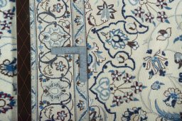 Backside of handmade 2000s Nain rug showing knot structure and weave density