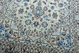 Close-up detail of 2000s Nain rug from Iran / Persia showing Wool weave