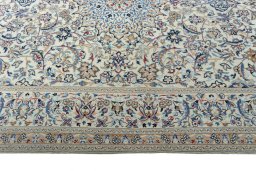 Corner detail of 2000s Nain rug showing border pattern and Wool pile