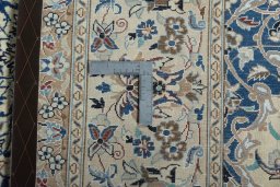 Backside of handmade 2000s Nain rug showing knot structure and weave density