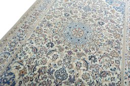 Backside of handmade 2000s Nain rug showing knot structure and weave density