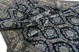 Corner detail of New Nain rug showing border pattern and Cork pile
