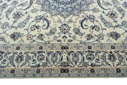 Corner detail of 2000s Nain rug showing border pattern and Wool pile