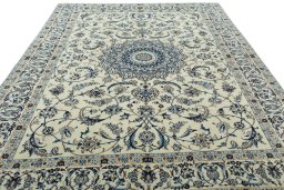 Surface texture of 2000s Nain rug with natural Wool and intricate pattern