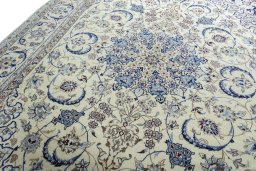 Backside of handmade New Nain rug showing knot structure and weave density