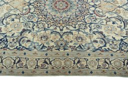 Corner detail of 2000s Nain rug showing border pattern and Wool pile