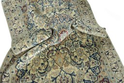 Surface texture of 2000s Nain rug with natural Wool and intricate pattern