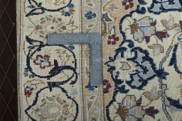 Backside of handmade 2000s Nain rug showing knot structure and weave density
