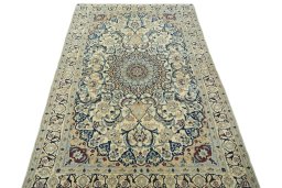 Surface texture of 2000s Nain rug with natural Wool and intricate pattern
