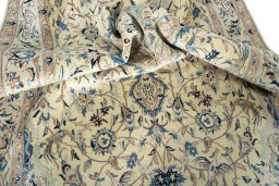 Surface texture of 2000s Nain rug with natural Wool and intricate pattern
